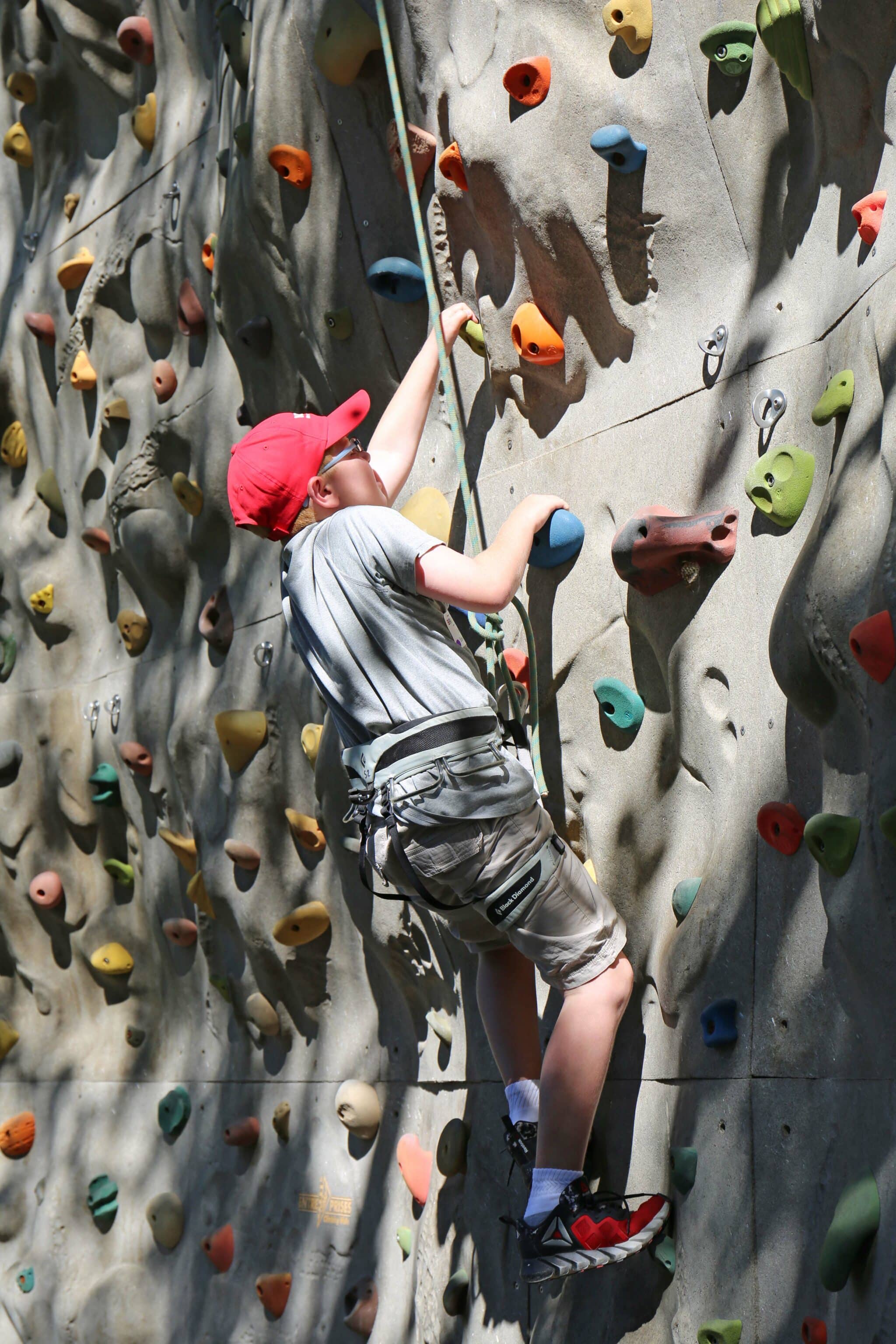 Scholars climbing wall