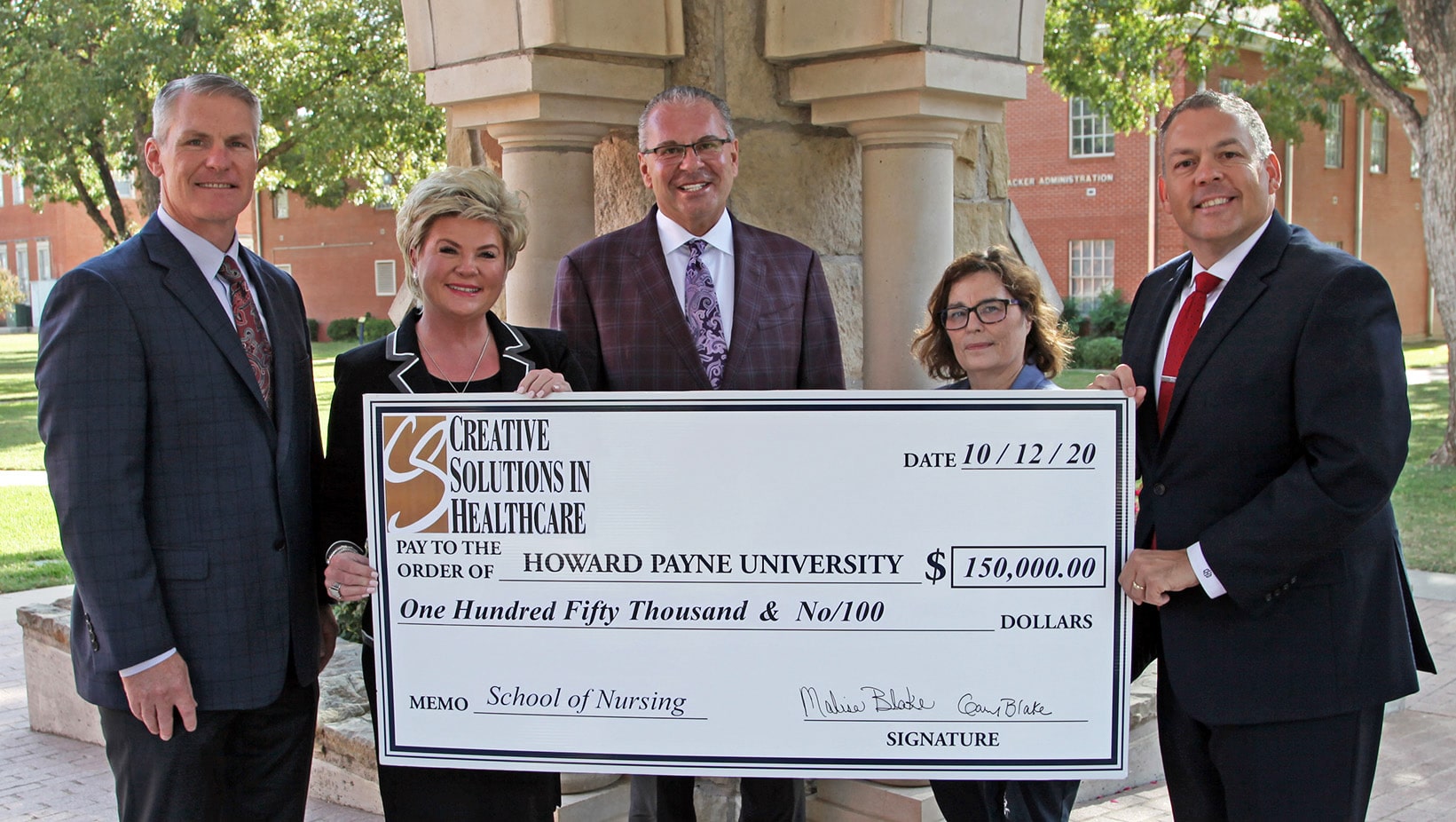 Group of individuals presenting a large ceremonial check to Howard Payne University from Creative Solutions in Healthcare. | HPU