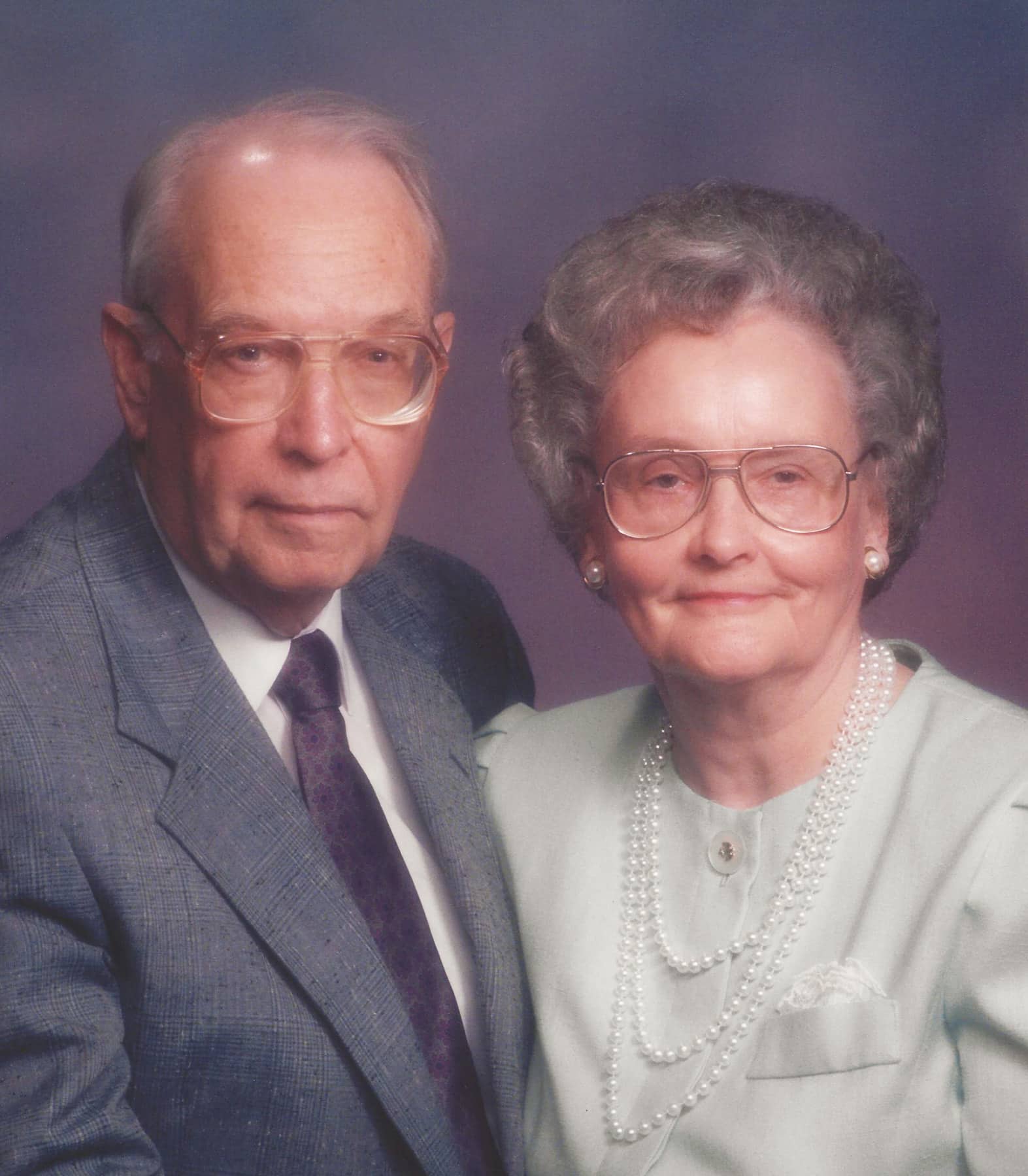 Elderly couple posing for a formal portrait at Howard Payne University. | HPU