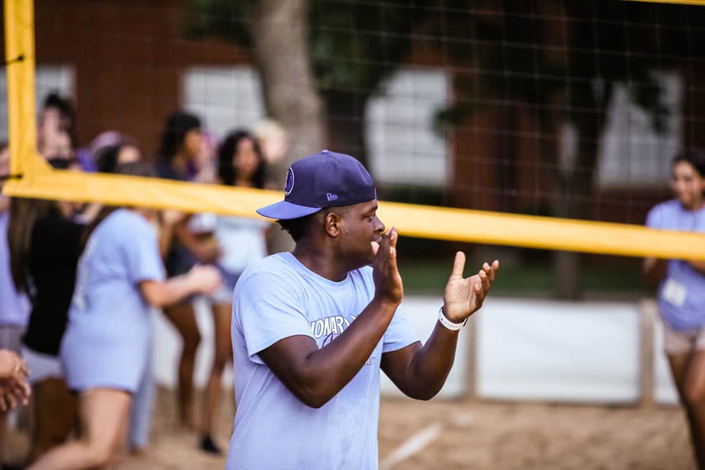 Coach giving instructions during a Howard Payne University volleyball match. | HPU
