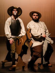Two actors from Howard Payne University in period costumes posing as a knight and squire with cardboard horses. | HPU