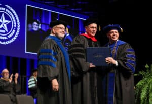 Pastor Ray Still (center), former chair of HPU’s Board of Trustees, received an honorary doctorate in recognition of his service to the university. He is pictured with Dr. Donnie Auvenshine, vice president for academic affairs, and Dr. Cory Hines, president.